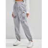 EMMIOL Pantalones joggers con estampado de mariposas y eslogan