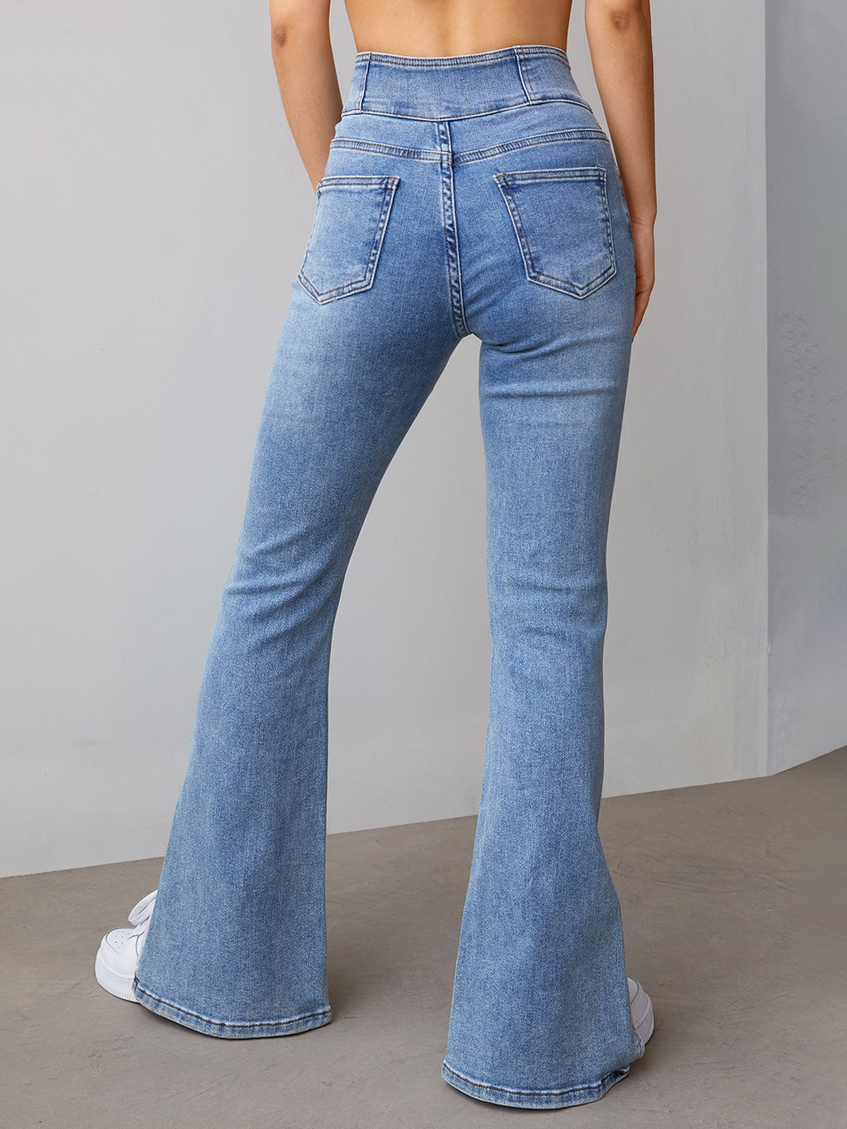 EMMIOL Jeans acampanados con abertura y botones