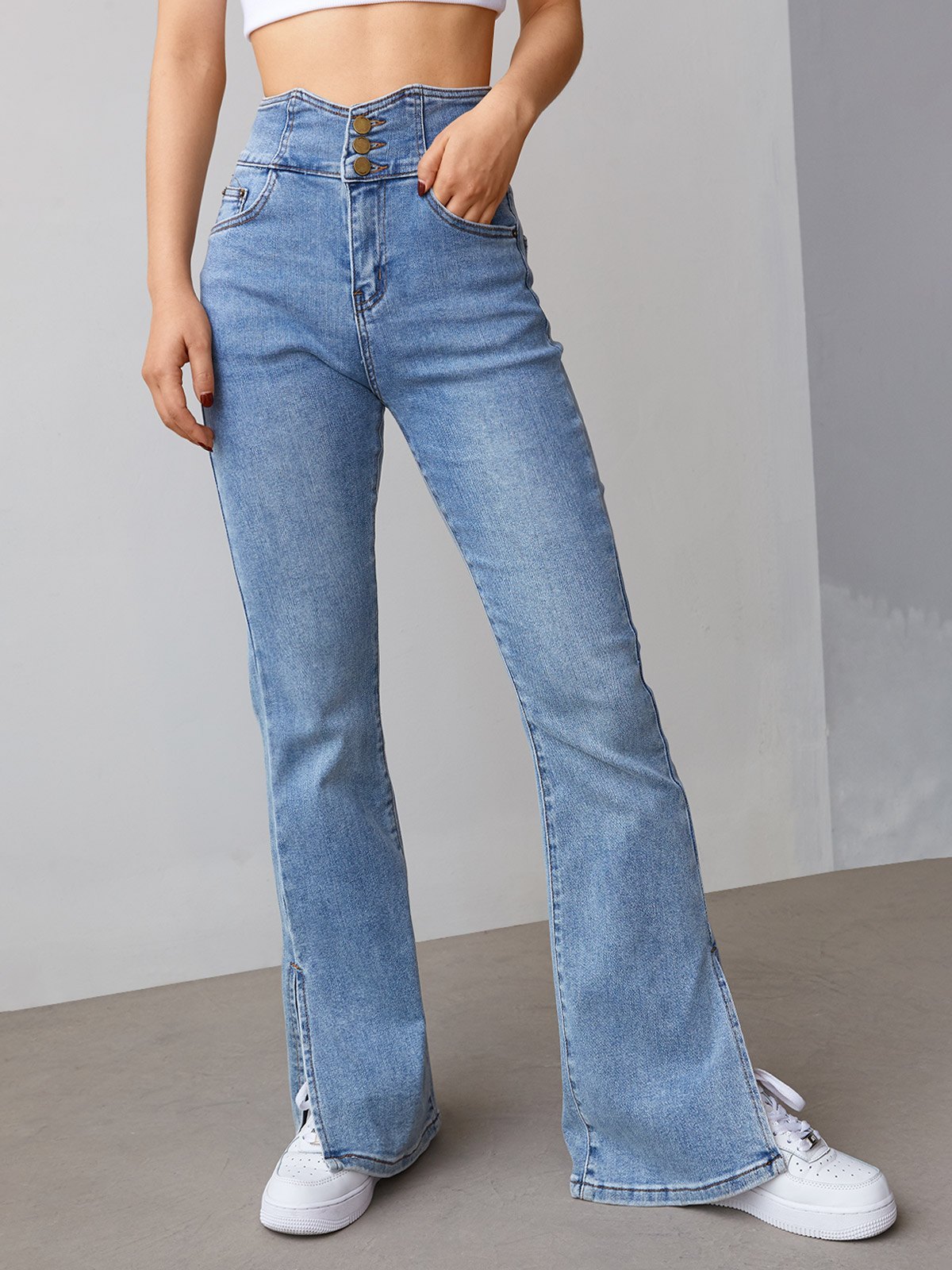 EMMIOL Jeans acampanados con abertura y botones