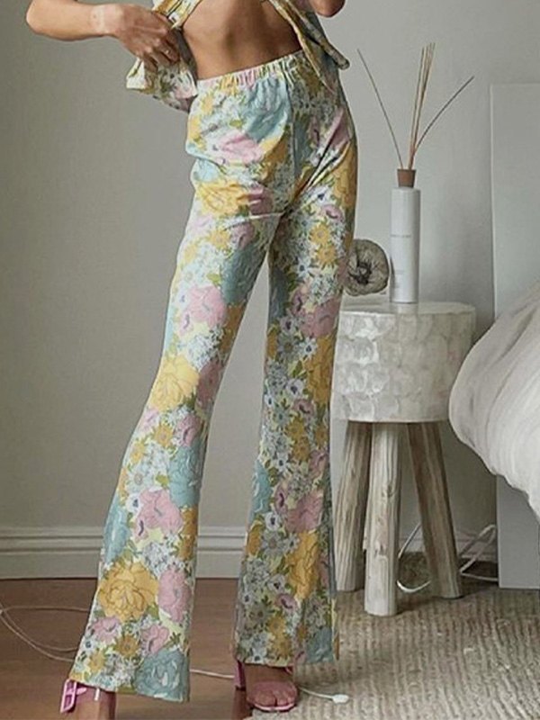 EMMIOL Pantalones acampanados con estampado floral