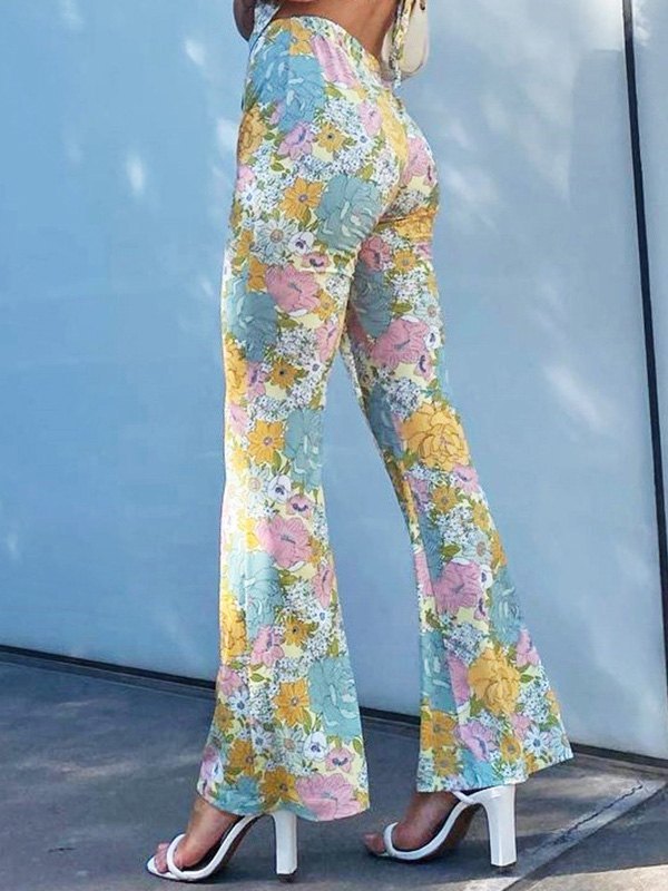 EMMIOL Pantalones acampanados con estampado floral