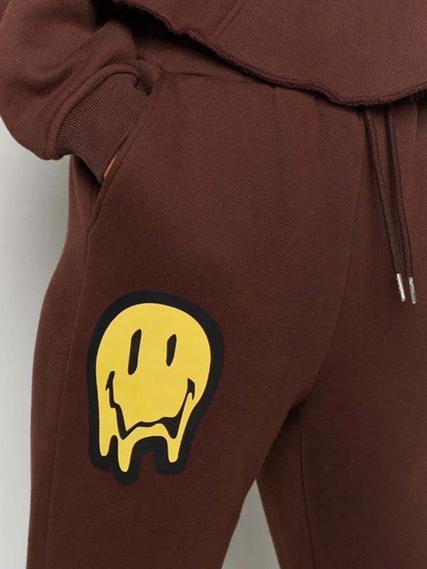 EMMIOL Pantalones joggers con estampado Drip Smile