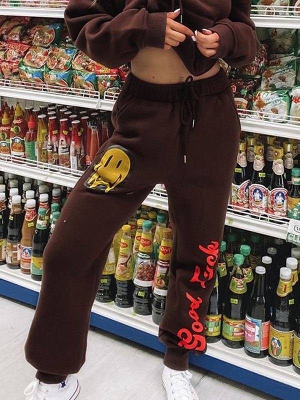 EMMIOL Pantalones joggers con estampado Drip Smile