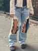 EMMIOL Un gran agujero en la rodilla en unos jeans rotos