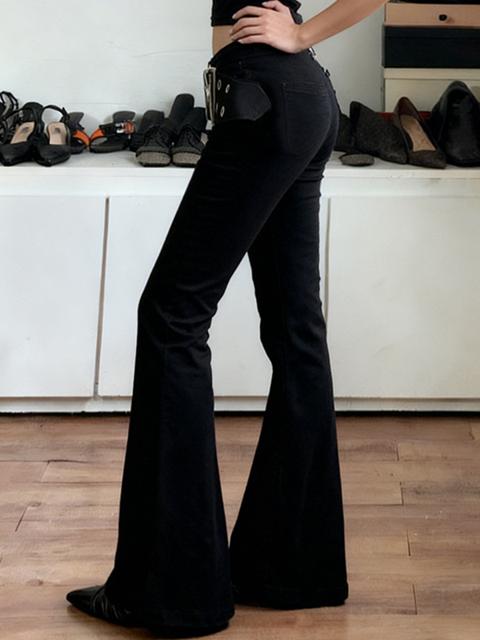 Jeans a zampa in stile industriale scuro con cuscinetto per mais